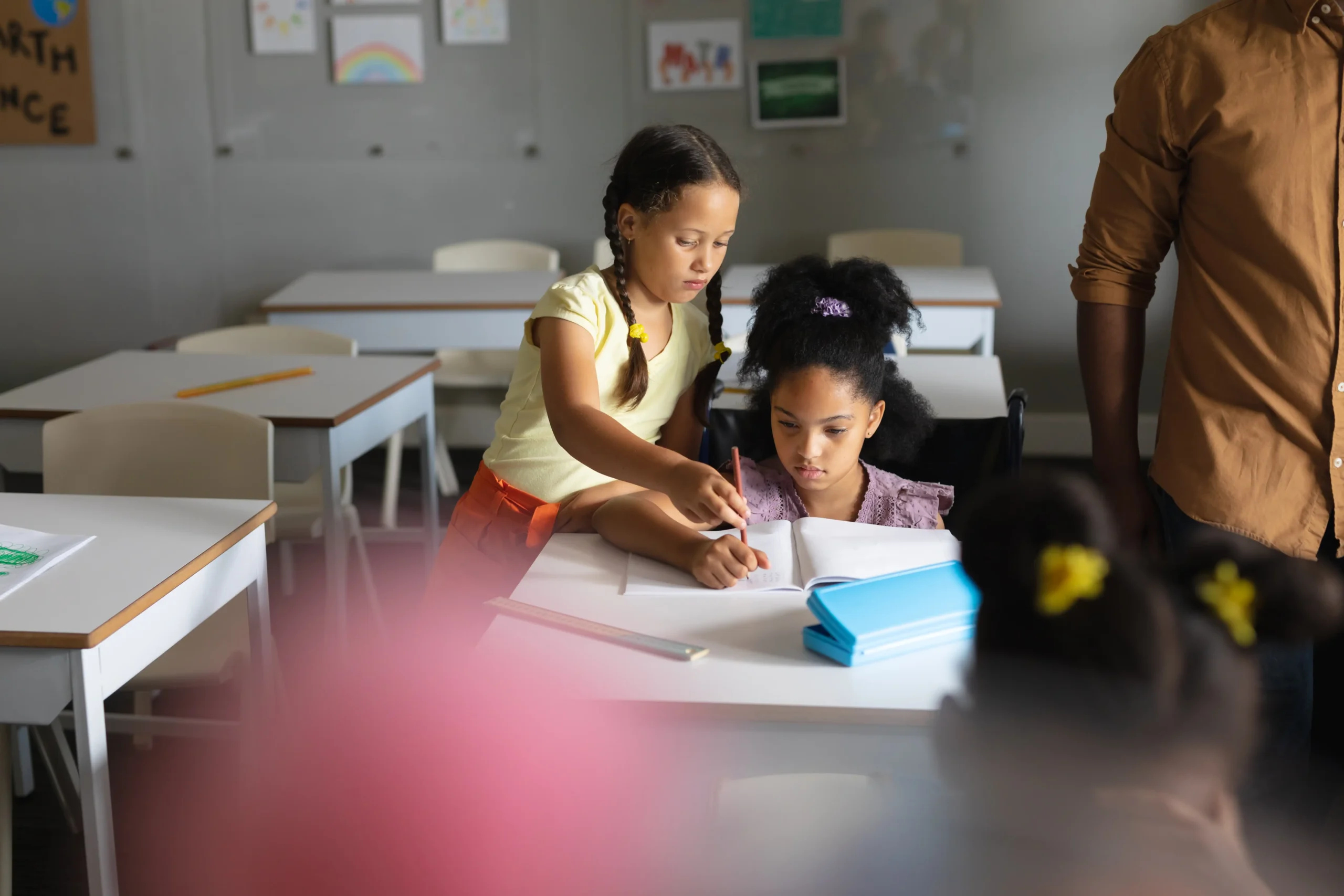 caucasian-elementary-schoolgirl-assisting-biracial-2026-01-09-09-37-36-utc