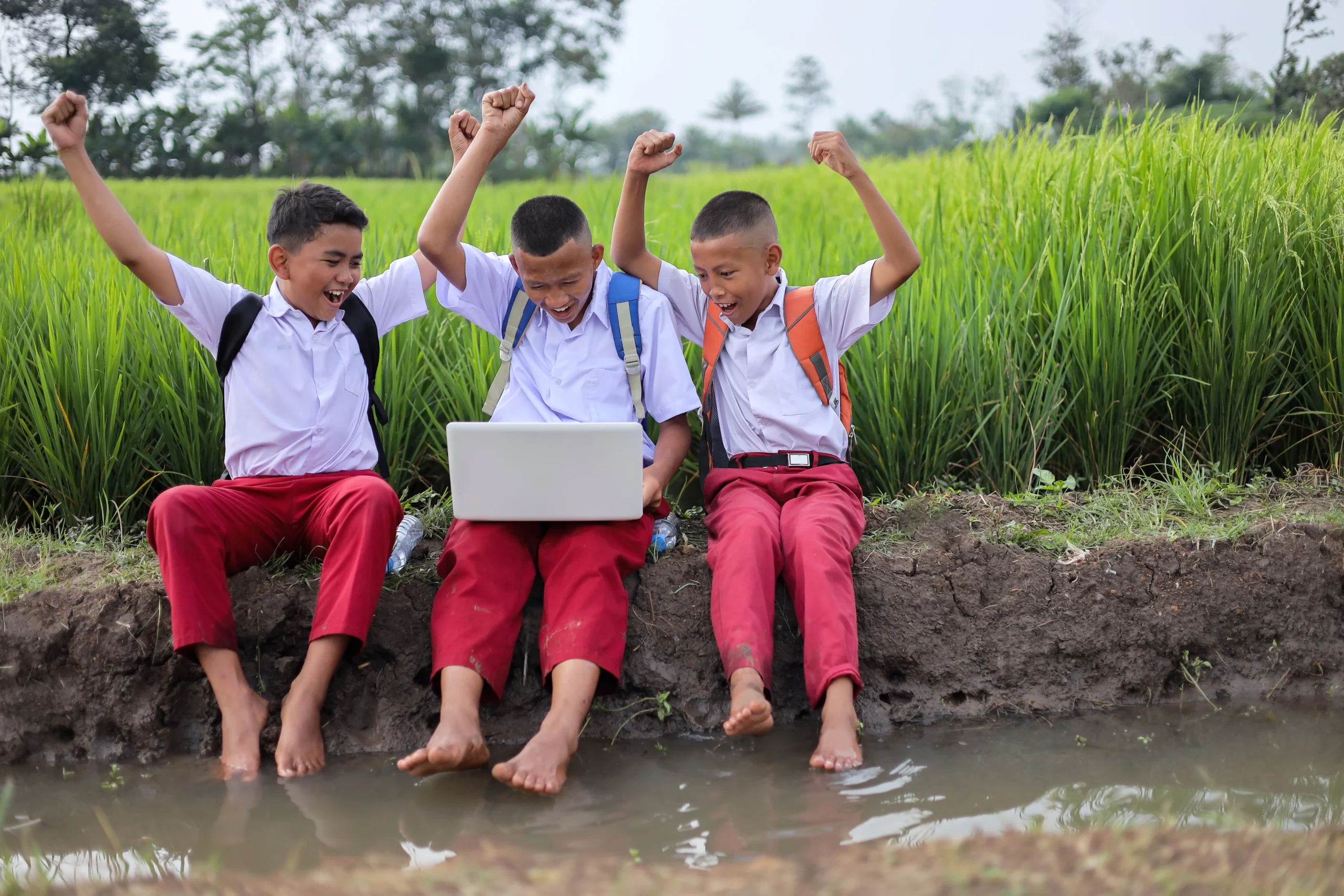 three-elementary-school-boys-cheering-excitedly-wh-2026-01-08-08-12-48-utc