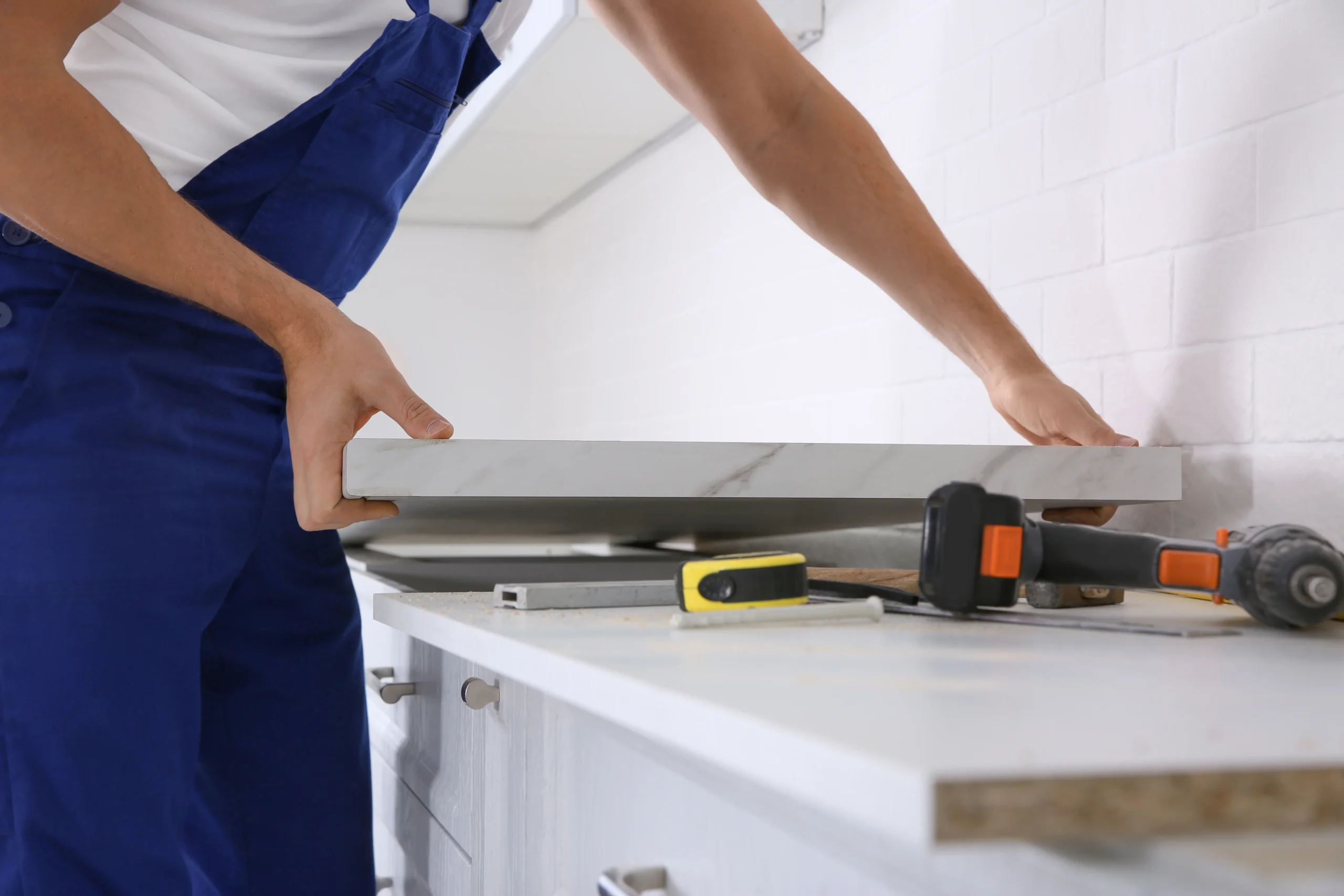 worker-installing-new-countertop-in-kitchen-close-2026-01-06-17-14-01-utc